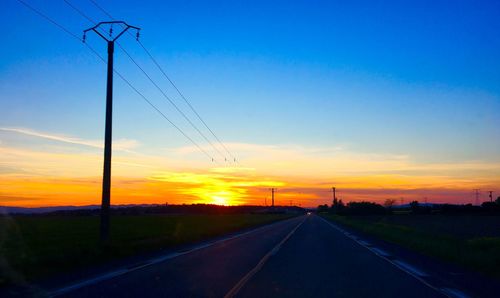 Empty road at sunset