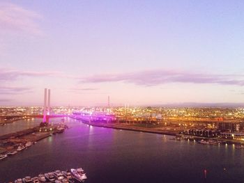 View of river in city against cloudy sky