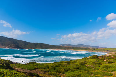 Scenic view of sea against blue sky