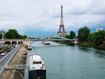 View of bridge over river against cloudy sky