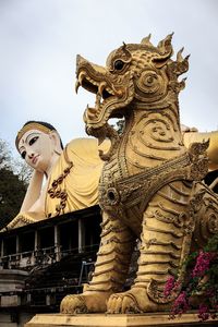 Low angle view of statue against building