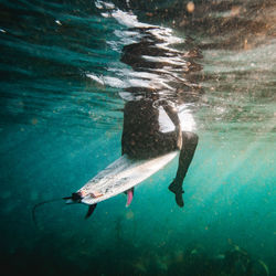 High angle view of man swimming in sea