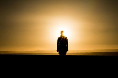 Silhouette of people at sunset