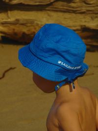 Rear view of shirtless man on beach