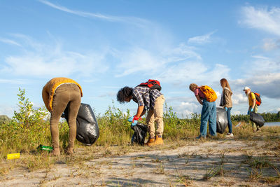 Group of people walking on field