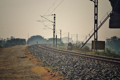 Railroad tracks against clear sky