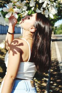 Side view of woman standing outdoors