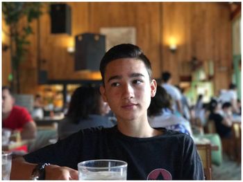 Portrait of man sitting in restaurant