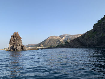 Scenic view of sea against clear blue sky