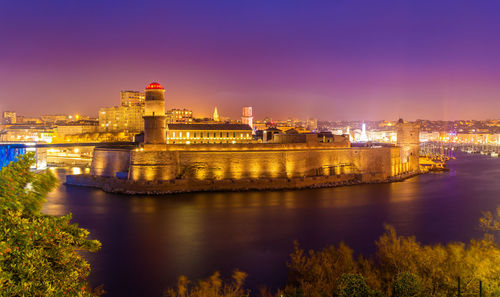 Illuminated buildings in city at night