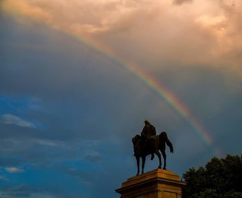 Low angle view of statue against cloudy sky