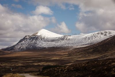 Scenic view of snowcapped mountain against sky