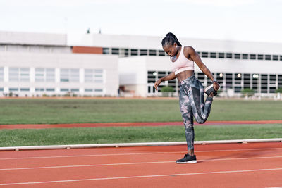 Full length of young woman running