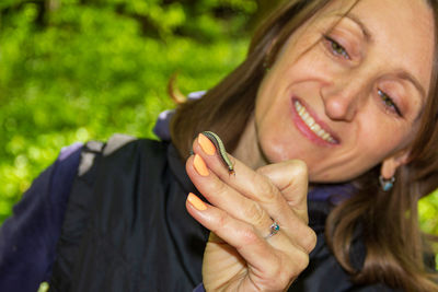 Close-up portrait of a smiling young woman