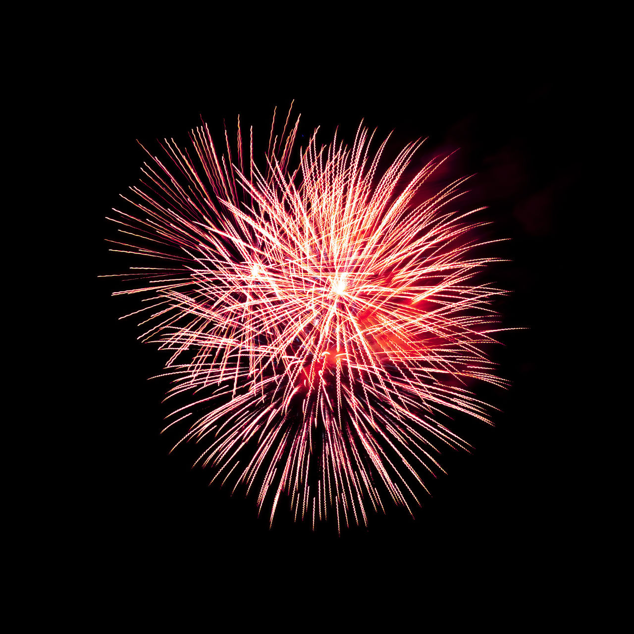 fireworks, celebration, motion, firework display, event, night, exploding, illuminated, arts culture and entertainment, recreation, no people, glowing, sky, nature, firework - man made object, blurred motion, long exposure, low angle view, multi colored, copy space, black background, outdoors, red, dark