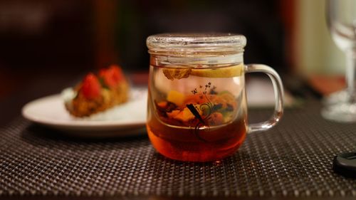 Close-up of tea in jar on table