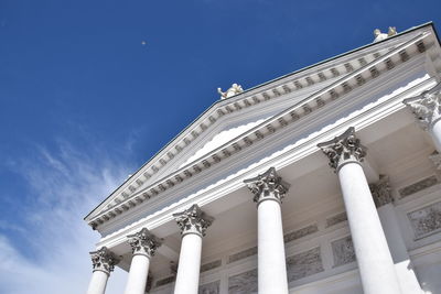 Low angle view of historical building against blue sky