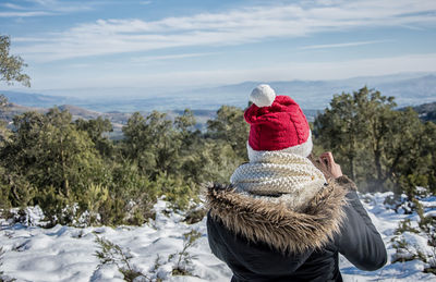 Rear view of woman in winter