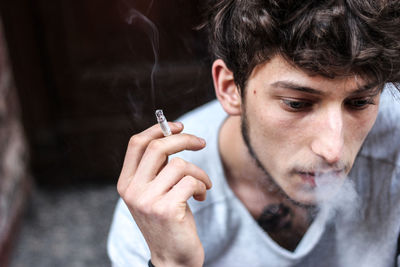 Close-up of man smoking cigarette