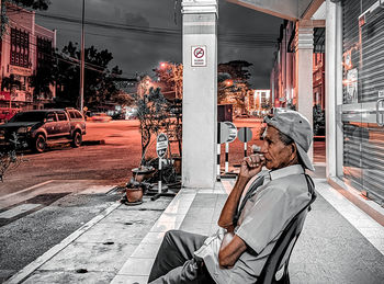 Man working on street in city