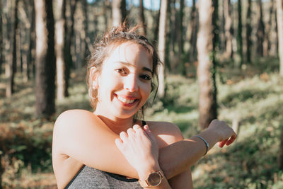 Portrait of young woman standing outdoors