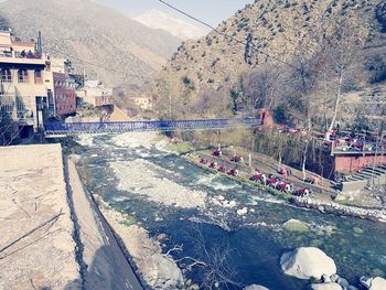 Aerial view of people on mountain by water