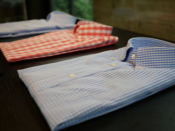 Close-up of folded shirts on table