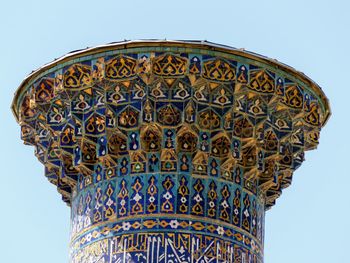 Low angle view of historical building against clear blue sky