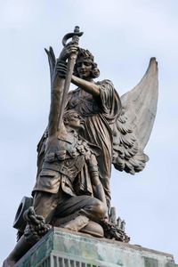 Low angle view of statue against sky