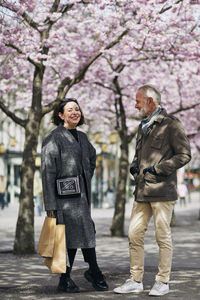 Mature couple standing in spring park