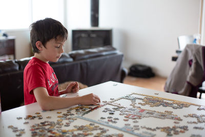 Boy sitting on table