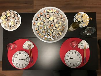 High angle view of clock on table