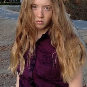 Portrait of beautiful young woman standing outdoors