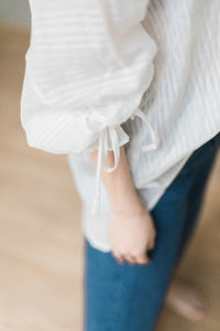 Low section of woman with high heels