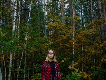 Portrait of young woman in forest