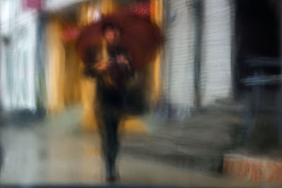 Portrait of man seen through window