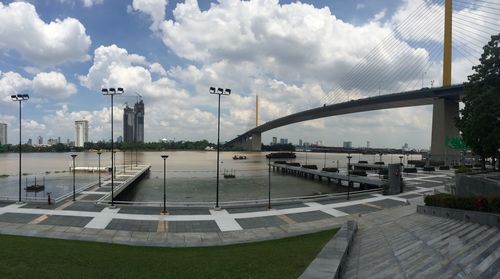 Bridge in city against sky