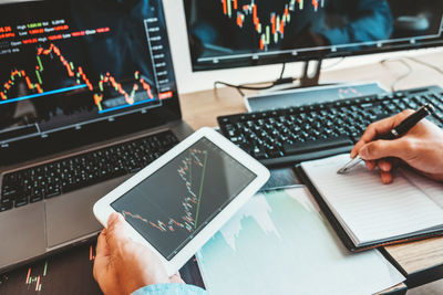 Low angle view of man using laptop on table