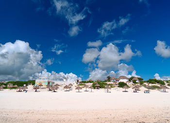 Panoramic view of beach against blue sky