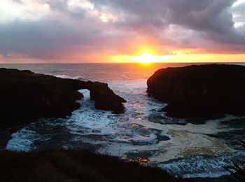 Scenic view of sea at sunset