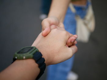 Close-up of man holding hands