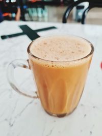 Close-up of coffee cup on table