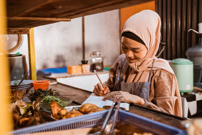 Portrait of young man working in workshop