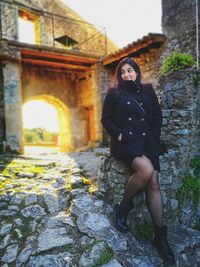 Portrait of woman against historic building