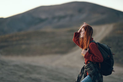 Rear view of woman looking at mountain