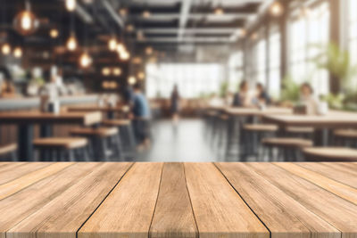 Close-up of wooden table at restaurant