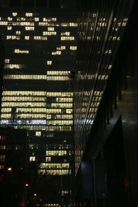 Illuminated building in city at night