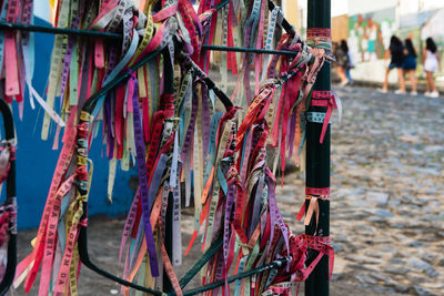 Colored ribbons of senhor do bonfim tied to an iron gate in pelourinho.