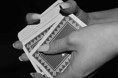 Close-up of hand holding paper