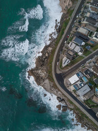 Aerial view of sea and buildings in city